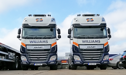 Two trucks with Williams Shipping branding
