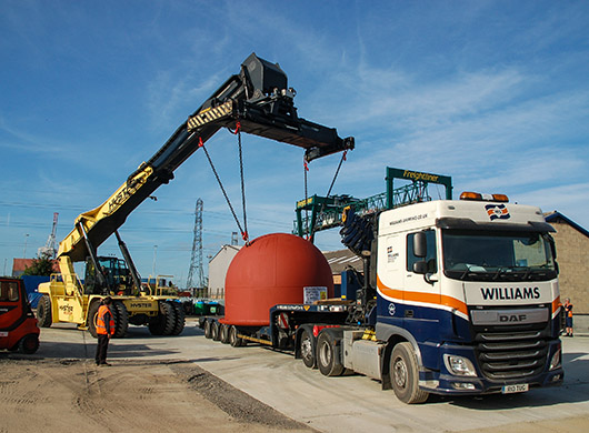 Crane lifting a big cube 