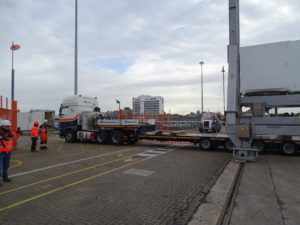 truck delivering large structure 