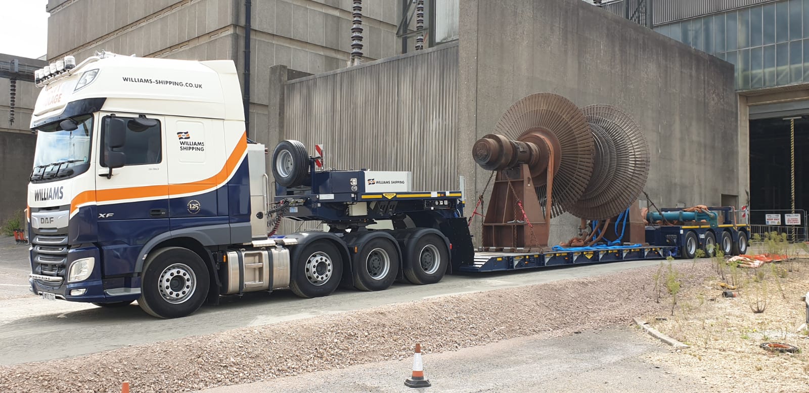 Large mechanical equipment on the trailer of a heavy haul truck