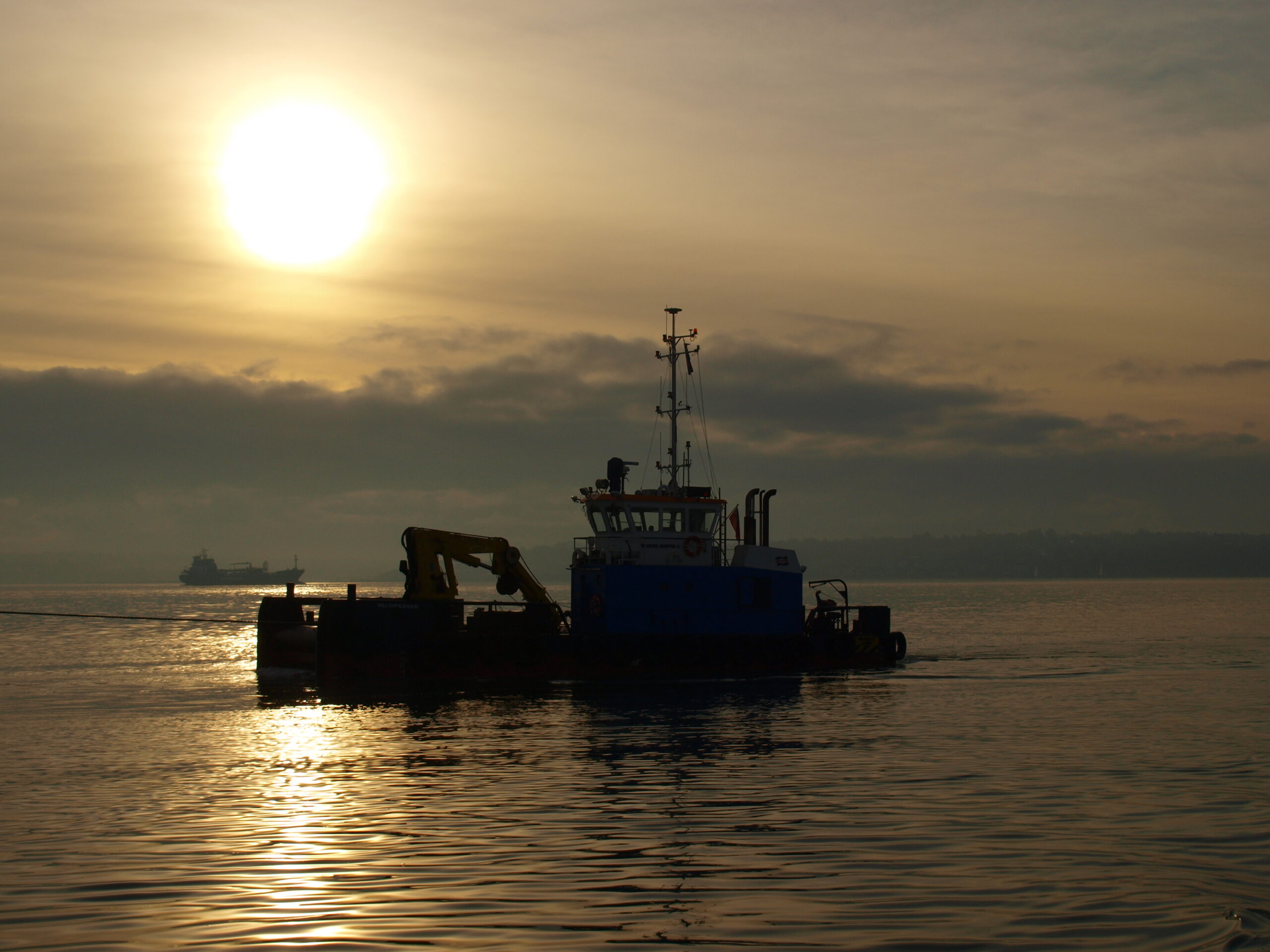 Workboat at sunset