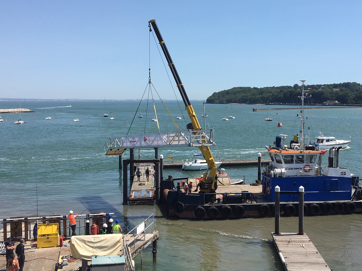 Wilendeavour lifting a pontoon bridge into place for the ISC